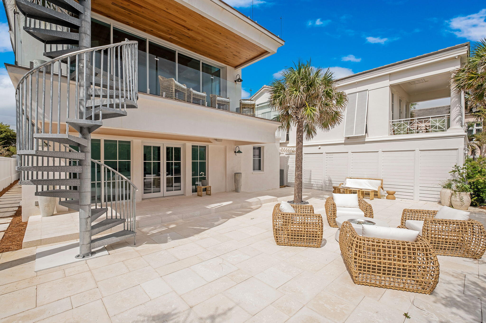 40 Jasmine Circle Santa Rosa Beach, FL 32459 - Photo 9 of 100 a view of a patio with couches and table and chairs and potted plants