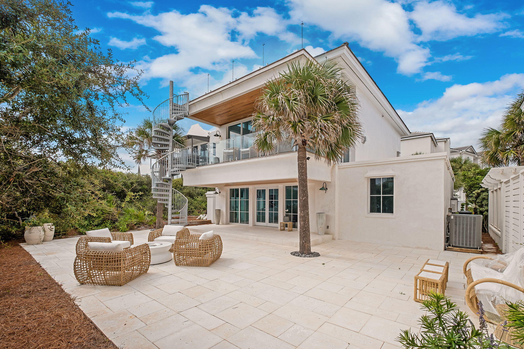 40 Jasmine Circle Santa Rosa Beach, FL 32459 - Photo 91 of 100 a view of a patio with couches table and chairs and potted plants