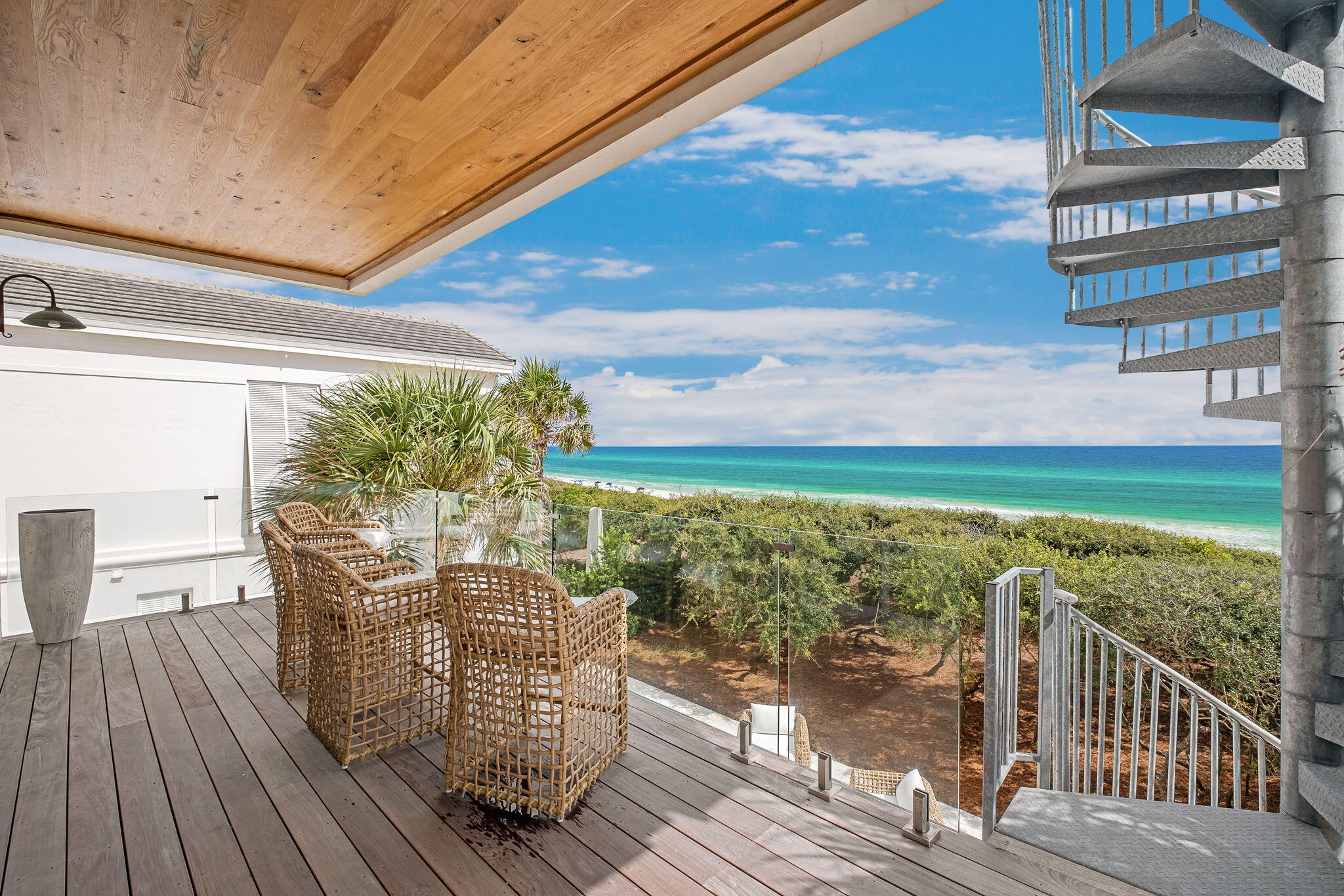 40 Jasmine Circle Santa Rosa Beach, FL 32459 - Photo 97 of 100 a view of a balcony with chair and wooden floor