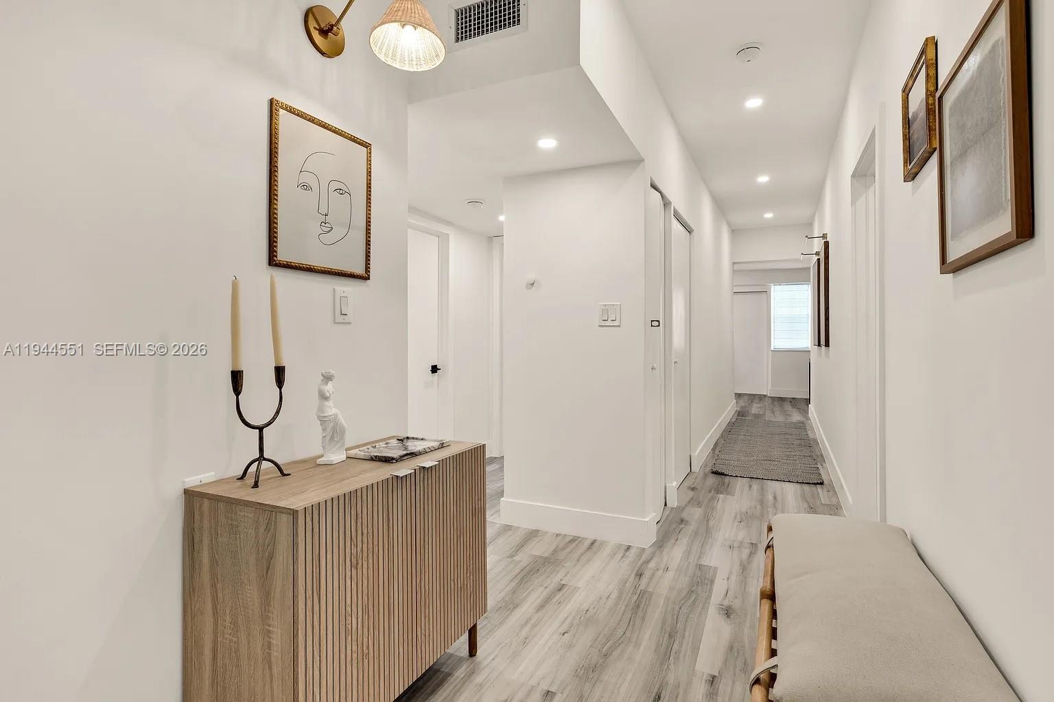 1237 Northwest 33rd Avenue, Unit 1 Miami, FL 33125 - Photo 12 of 22 a view of an entryway with wooden floor