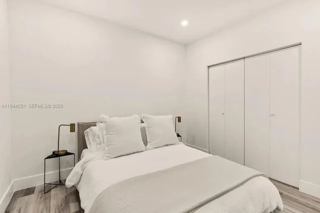 a bedroom with a bed and a dresser