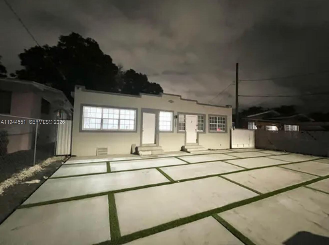 1237 Northwest 33rd Avenue, Unit 1 Miami, FL 33125 - Photo 22 of 22 a living room with stainless steel appliances kitchen island granite countertop a sink and cabinets