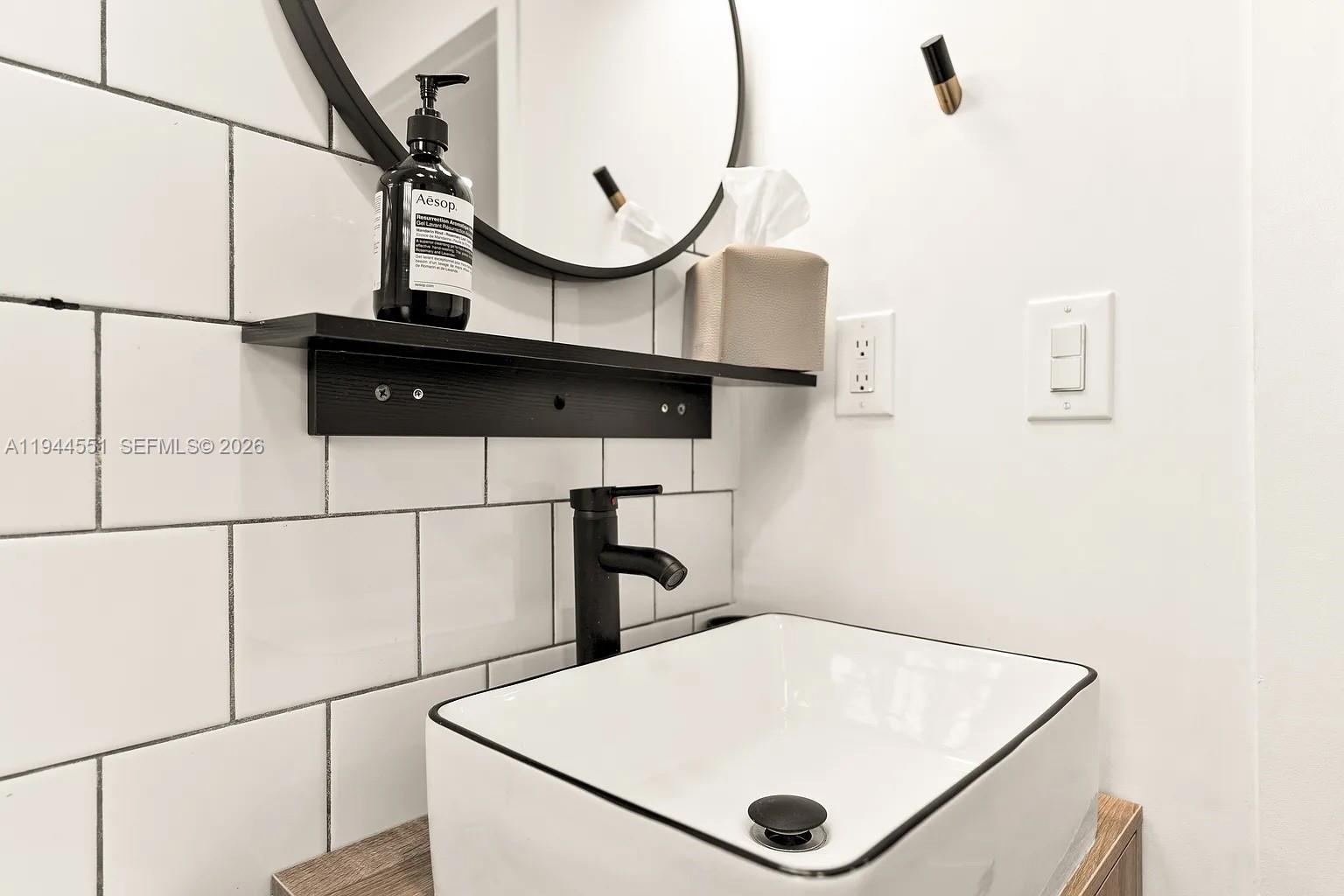 1237 Northwest 33rd Avenue, Unit 1 Miami, FL 33125 - Photo 4 of 22 a room with wooden floor