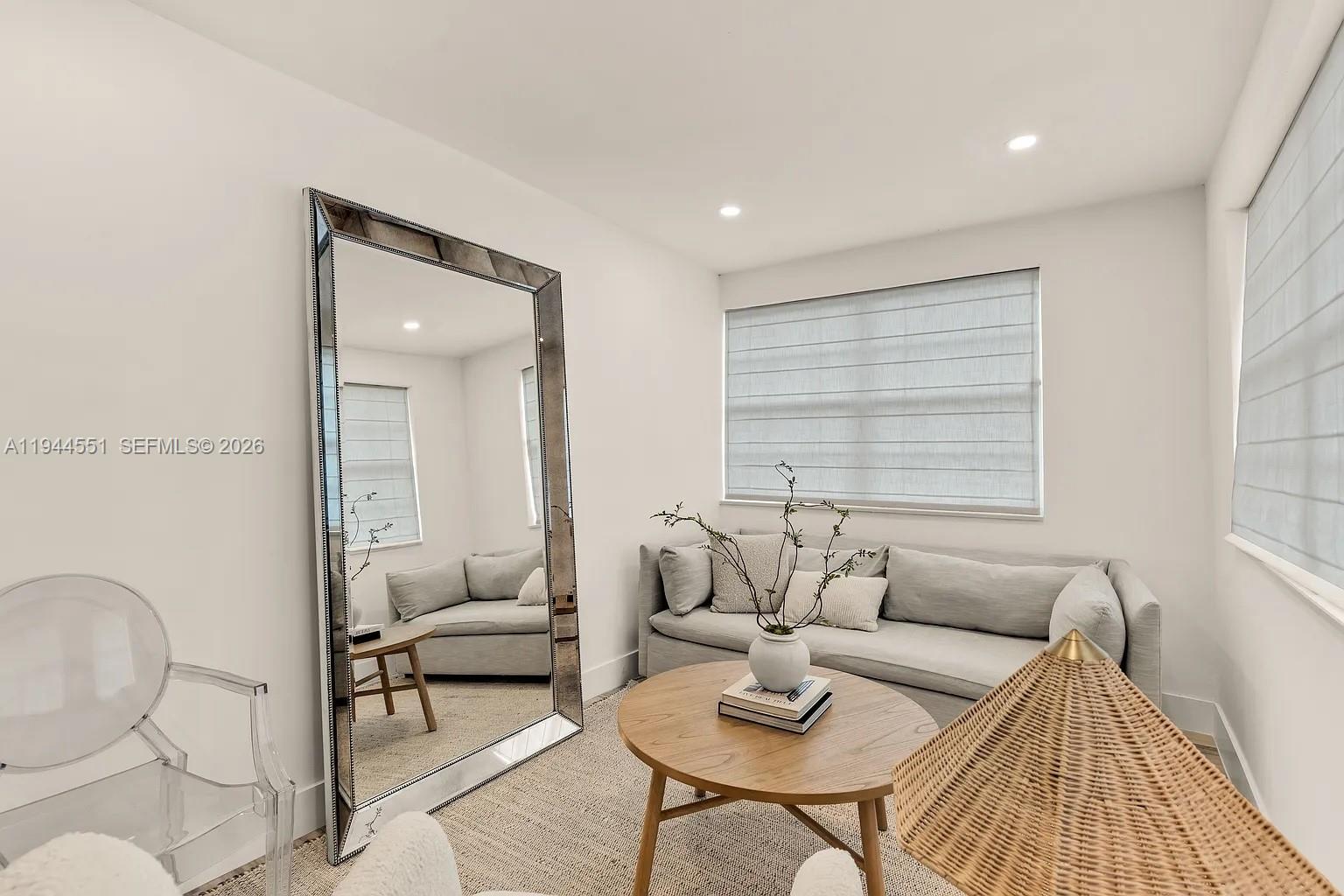 1237 Northwest 33rd Avenue, Unit 1 Miami, FL 33125 - Photo 7 of 22 a living room with furniture