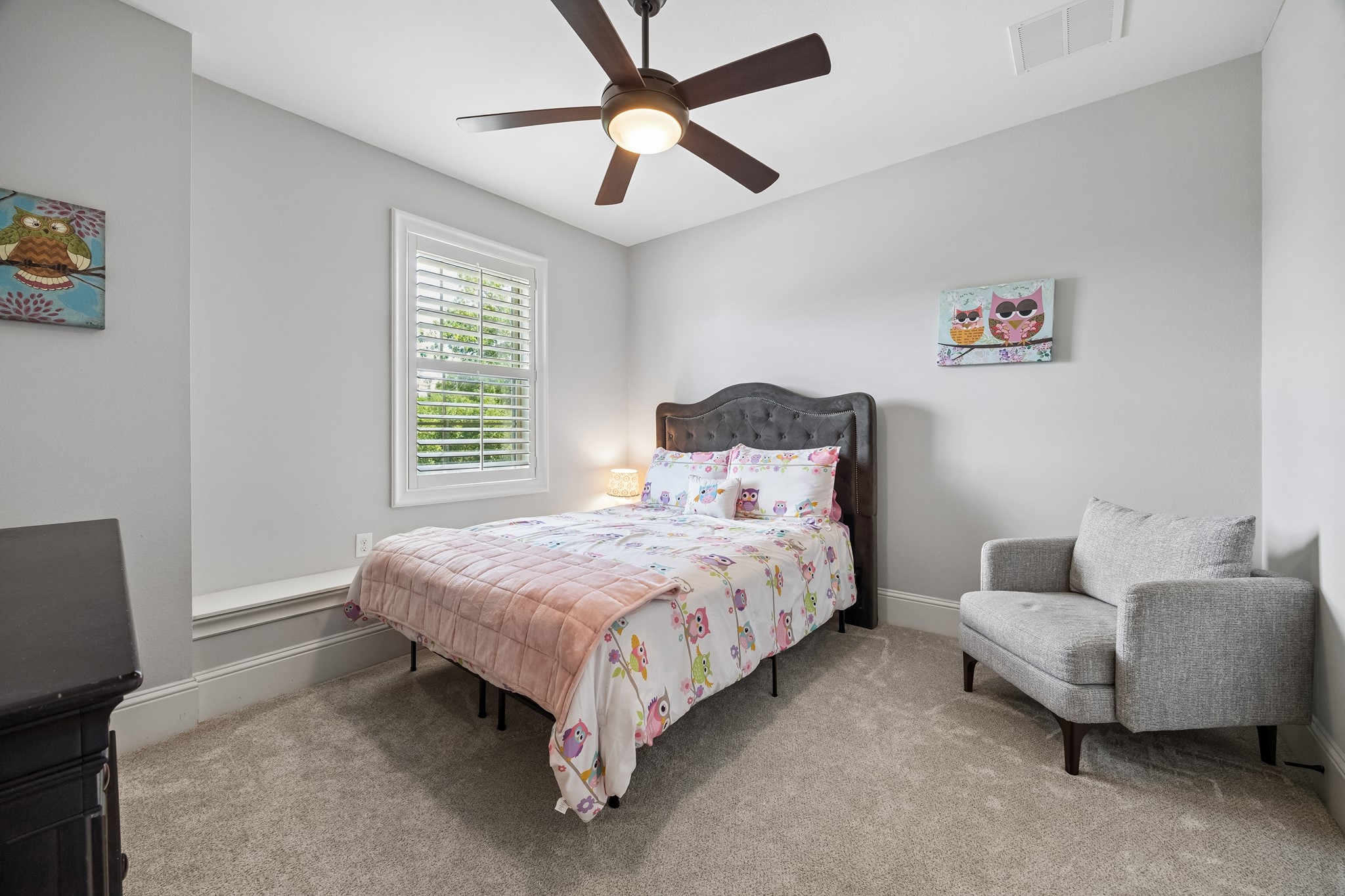 1360 Chippendale Road Houston, TX 77018 - Photo 25 of 34 Charming secondary bedroom #3 featuring plantation shutters, window seat, ceiling fan, and built-in closet organization. Comfortable and versatile space offering excellent natural light and easy access to the nearby shared bath.