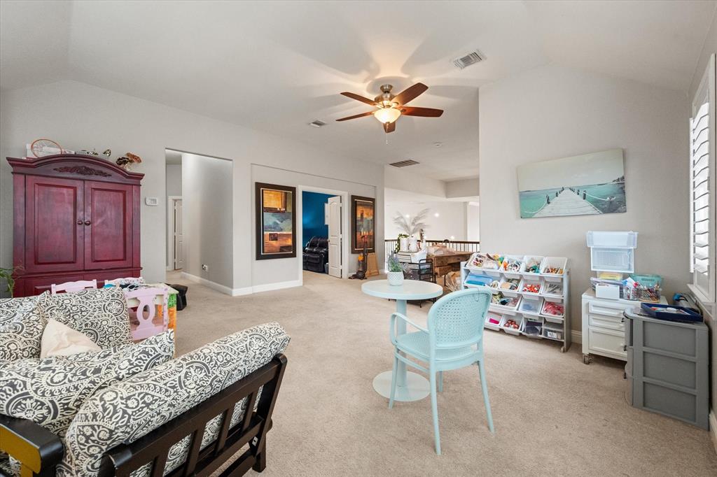 6713 Matador Ranch Road North Richland Hills, TX 76182 - Photo 25 of 39 Bedroom featuring light carpet and ceiling fan