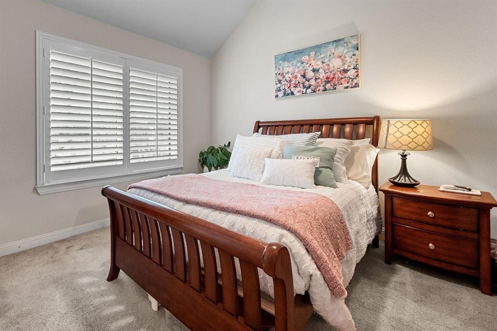 6713 Matador Ranch Road North Richland Hills, TX 76182 - Photo 31 of 39 Bedroom featuring carpet flooring and lofted ceiling