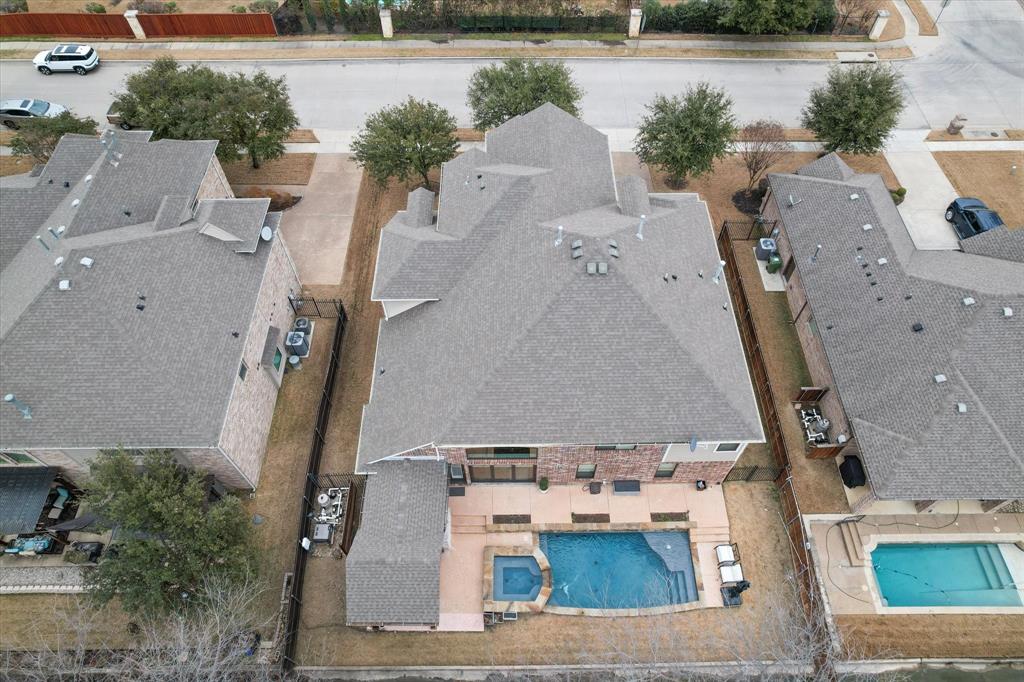 6713 Matador Ranch Road North Richland Hills, TX 76182 - Photo 38 of 39 Aerial view of residential area featuring a pool