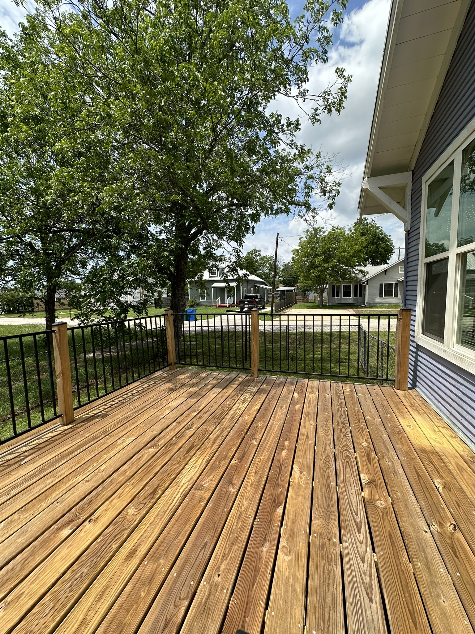 719 West 3rd Street Taylor, TX 76574 - Photo 20 of 31 View of wooden deck