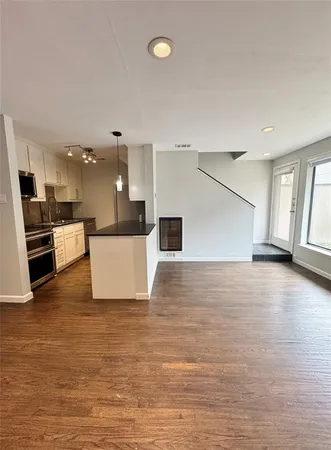 a view of a kitchen with a microwave and a stove
