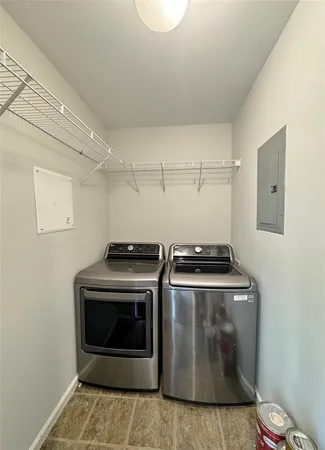a stove top oven sitting inside of a kitchen