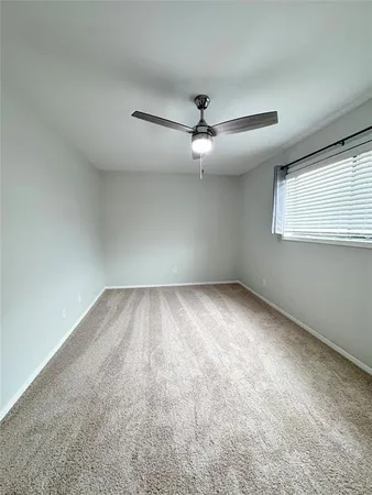 an empty room with a empty space and windows