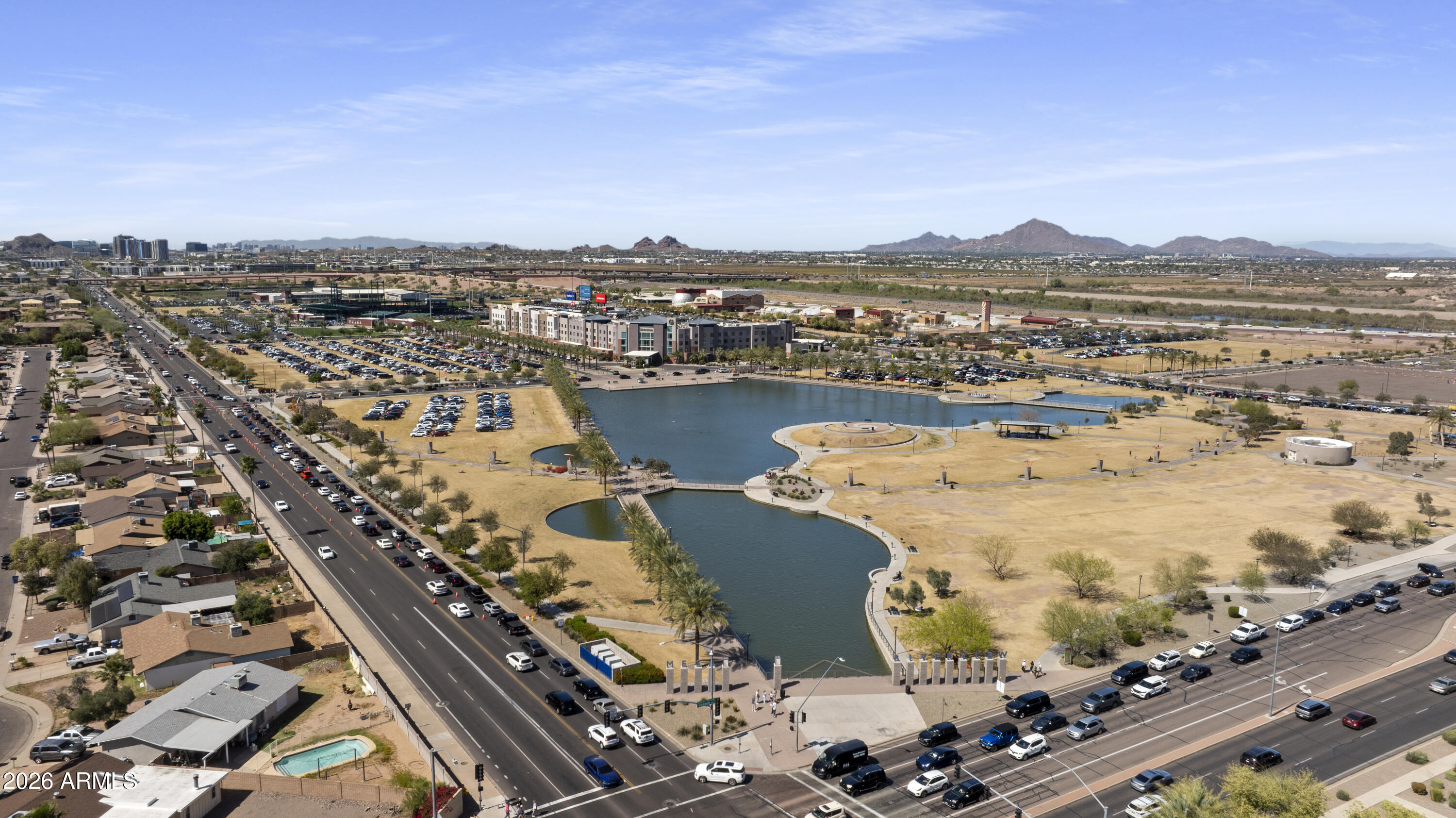 1505 North Center Street, Unit 115 Mesa, AZ 85201 - Photo 21 of 24 an aerial view of ocean and residential houses with outdoor space