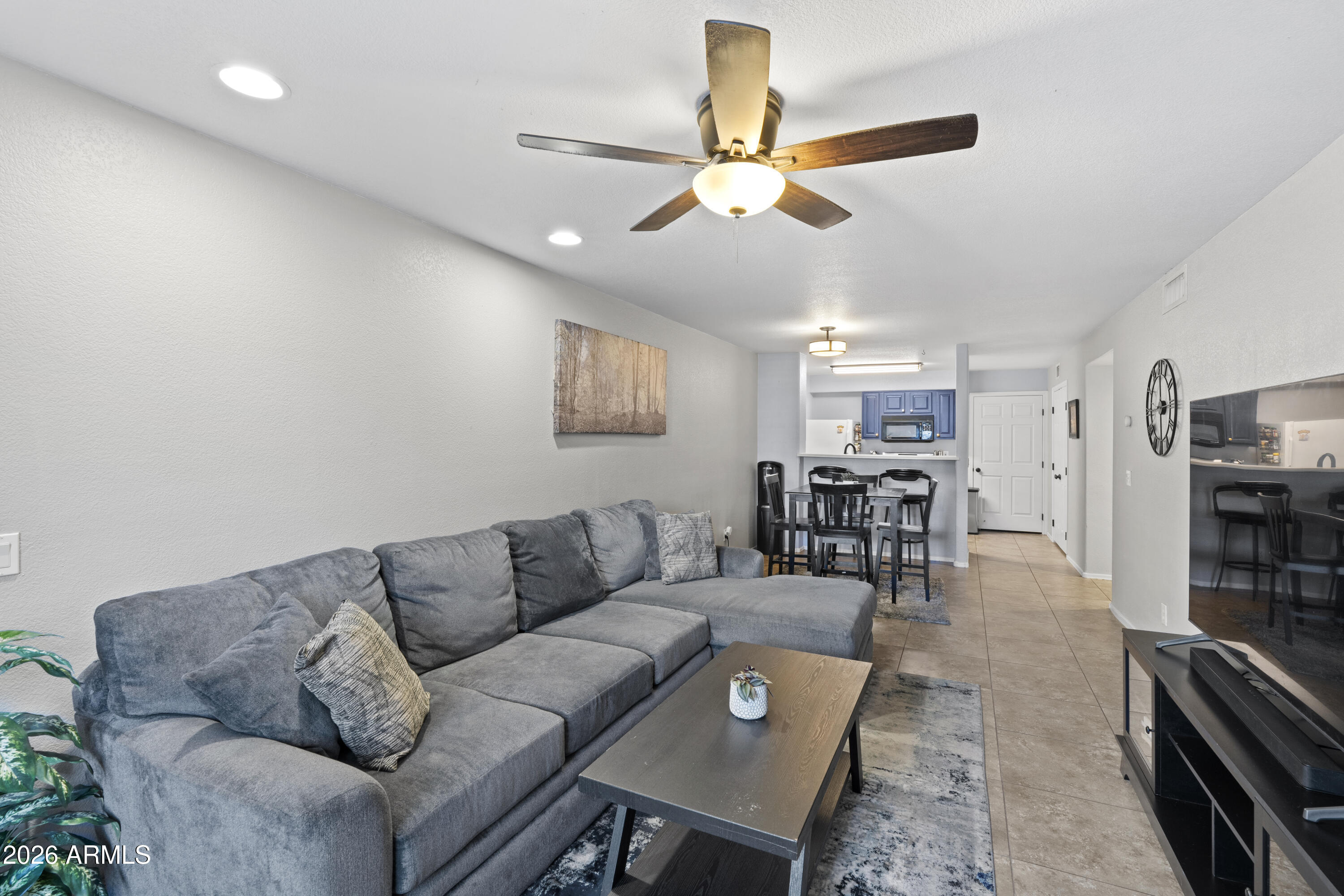 1505 North Center Street, Unit 115 Mesa, AZ 85201 - Photo 7 of 24 a living room with furniture and view of kitchen