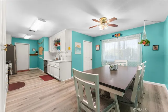 a kitchen with a table and chairs