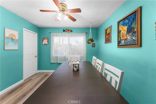 a hallway with furniture and a chandelier