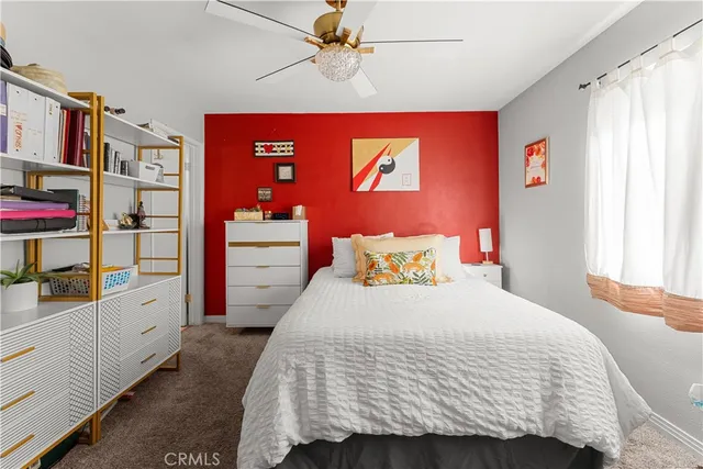 a bedroom with a bed and a closet