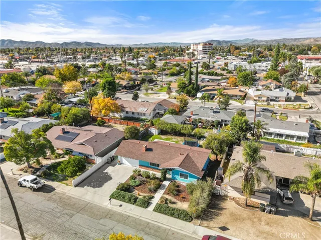 an aerial view of residential houses with outdoor space