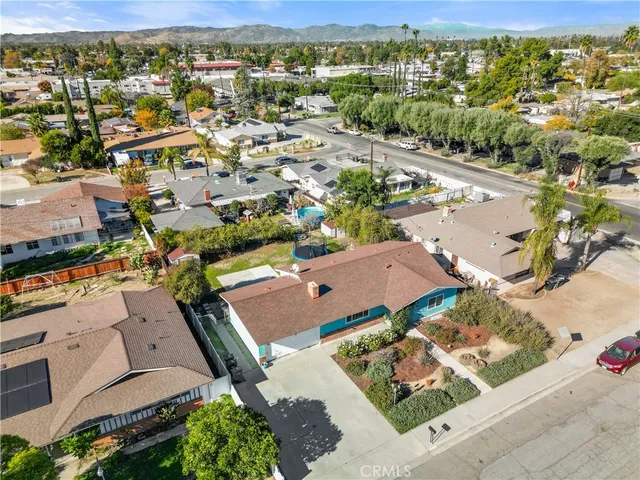 an aerial view of residential houses with outdoor space