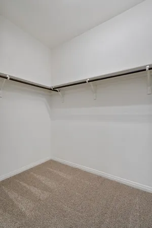 a view of a room with an empty walk in closet