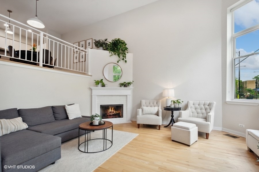 844 East 45th Street Chicago, IL 60653 - Photo 2 of 26 a living room with furniture and a fireplace
