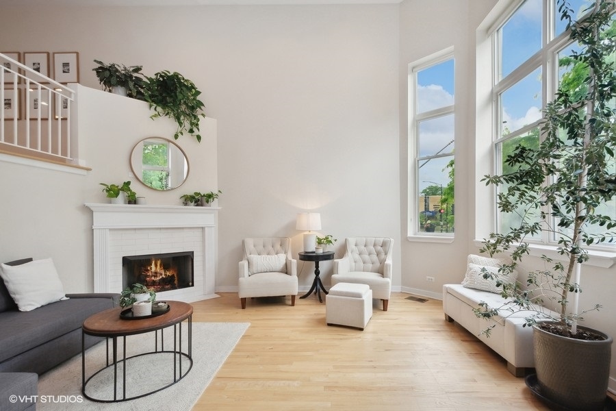 844 East 45th Street Chicago, IL 60653 - Photo 3 of 26 a living room with furniture a fireplace and a potted plant