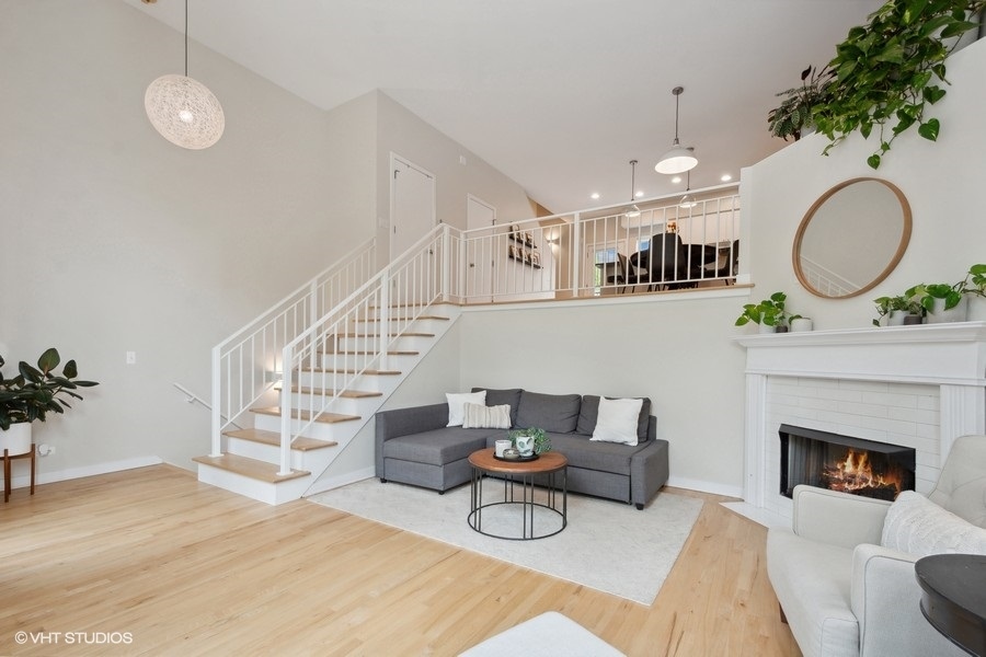 844 East 45th Street Chicago, IL 60653 - Photo 5 of 26 a living room with furniture and a fireplace