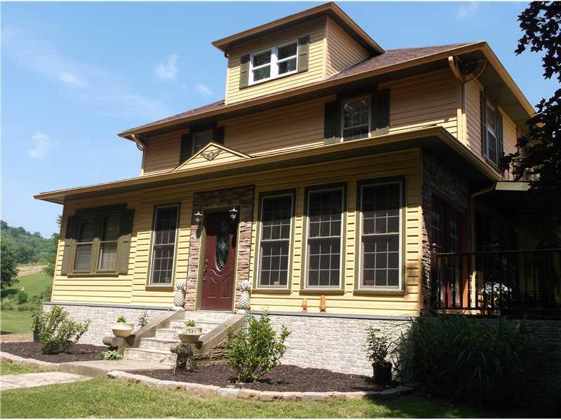 271 Strope Road Aleppo, PA 15310 - Photo 3 of 25 Exterior Front. A view of the front door of the home leading to the enclosed sunroom!