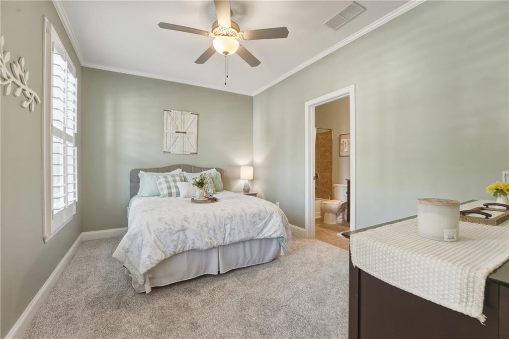 3330 Camelot Way Cumming, GA 30040 - Photo 19 of 47 a bedroom with a bed and window