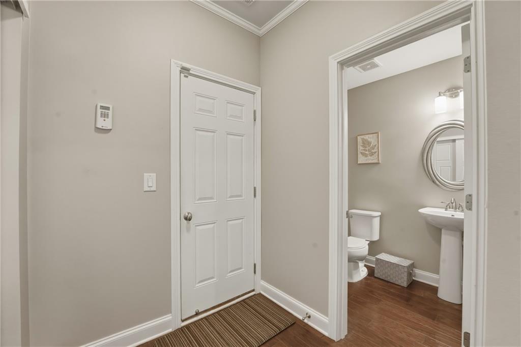 3330 Camelot Way Cumming, GA 30040 - Photo 22 of 47 a bathroom with a toilet a sink and mirror