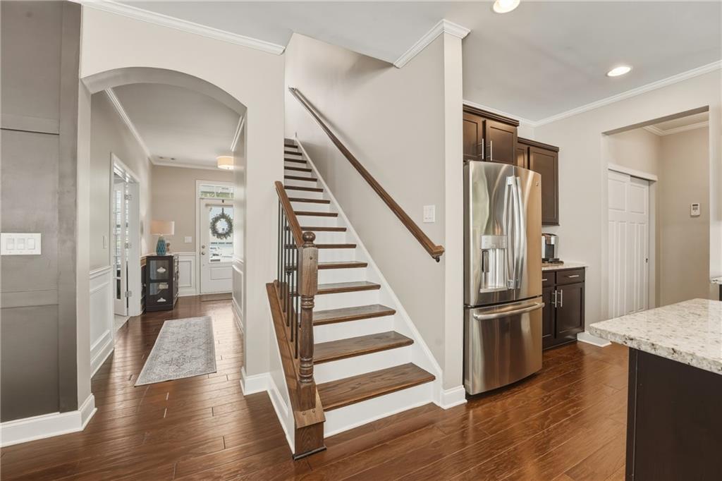 3330 Camelot Way Cumming, GA 30040 - Photo 23 of 47 a view of entryway and hall with wooden floor