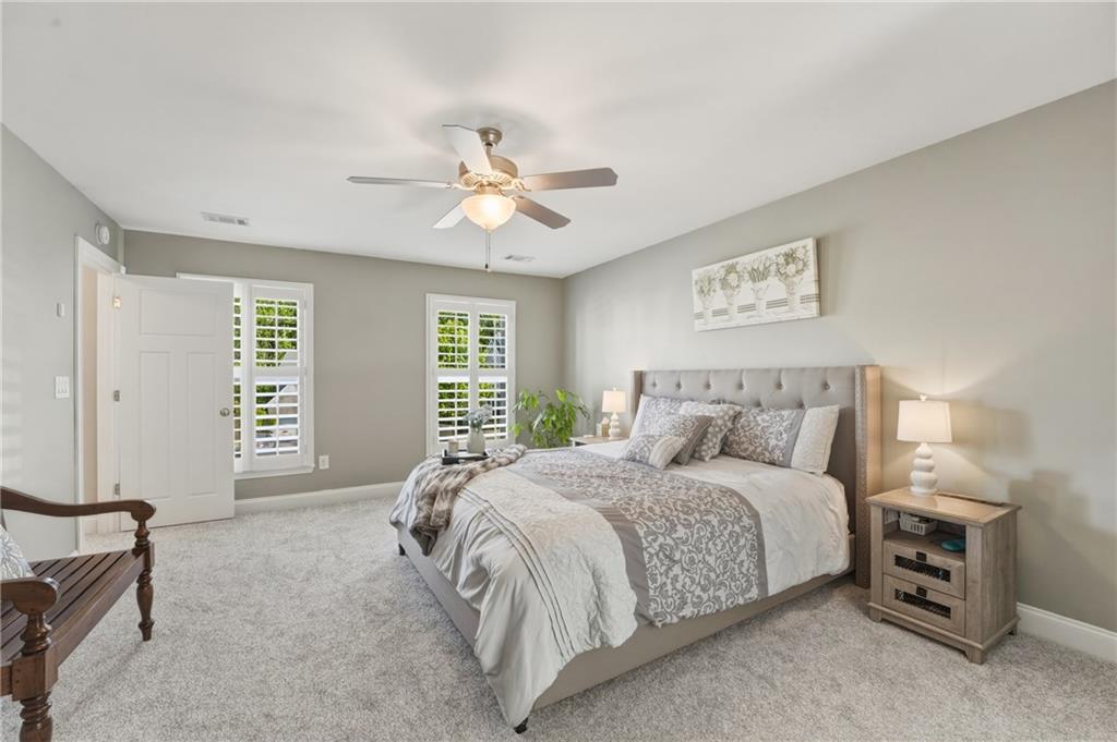3330 Camelot Way Cumming, GA 30040 - Photo 24 of 47 a bedroom with a bed and a window