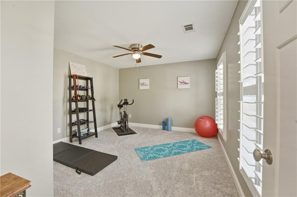 3330 Camelot Way Cumming, GA 30040 - Photo 30 of 47 a view of a room with window and couch