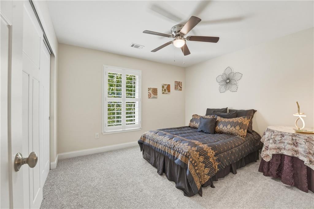 3330 Camelot Way Cumming, GA 30040 - Photo 33 of 47 a bedroom with a bed and window