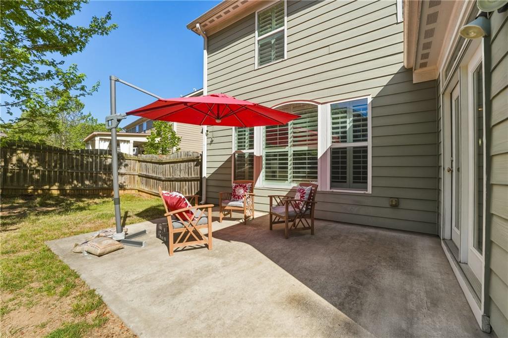 3330 Camelot Way Cumming, GA 30040 - Photo 38 of 47 an outdoor space with patio the tables and chairs