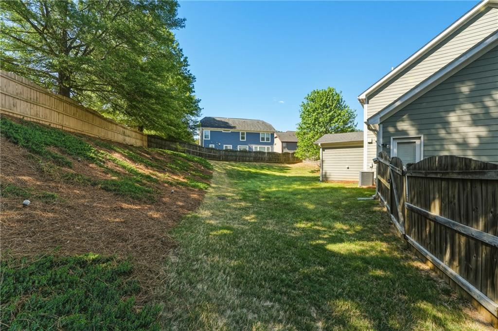 3330 Camelot Way Cumming, GA 30040 - Photo 39 of 47 a view of a house with a yard
