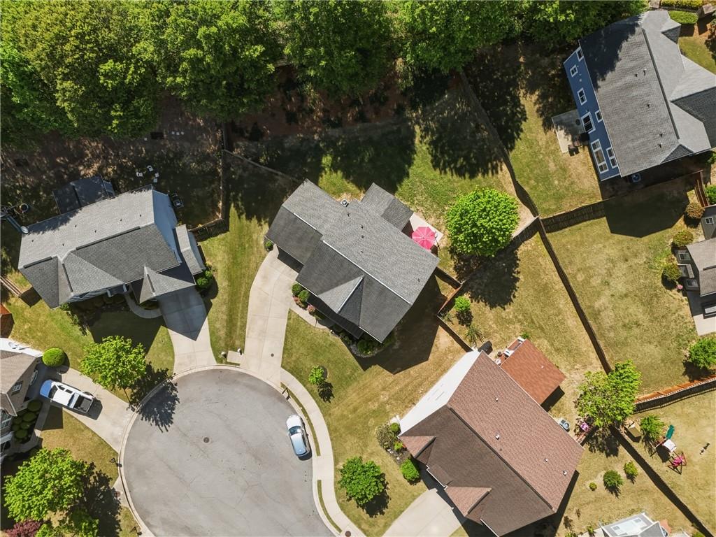 3330 Camelot Way Cumming, GA 30040 - Photo 46 of 47 an aerial view of a house with outdoor space and a large tree