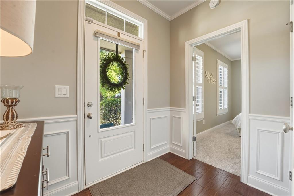 3330 Camelot Way Cumming, GA 30040 - Photo 5 of 47 hallway with wooden floor and windows