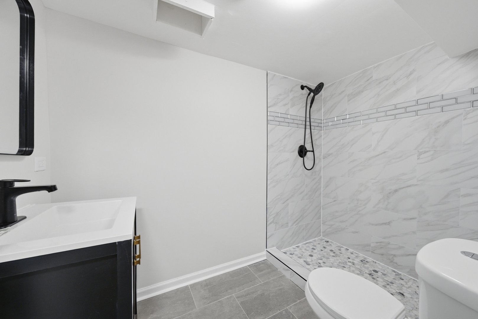 12358 South Lowe Avenue Chicago, IL 60628 - Photo 9 of 14 a bathroom with a sink toilet and shower