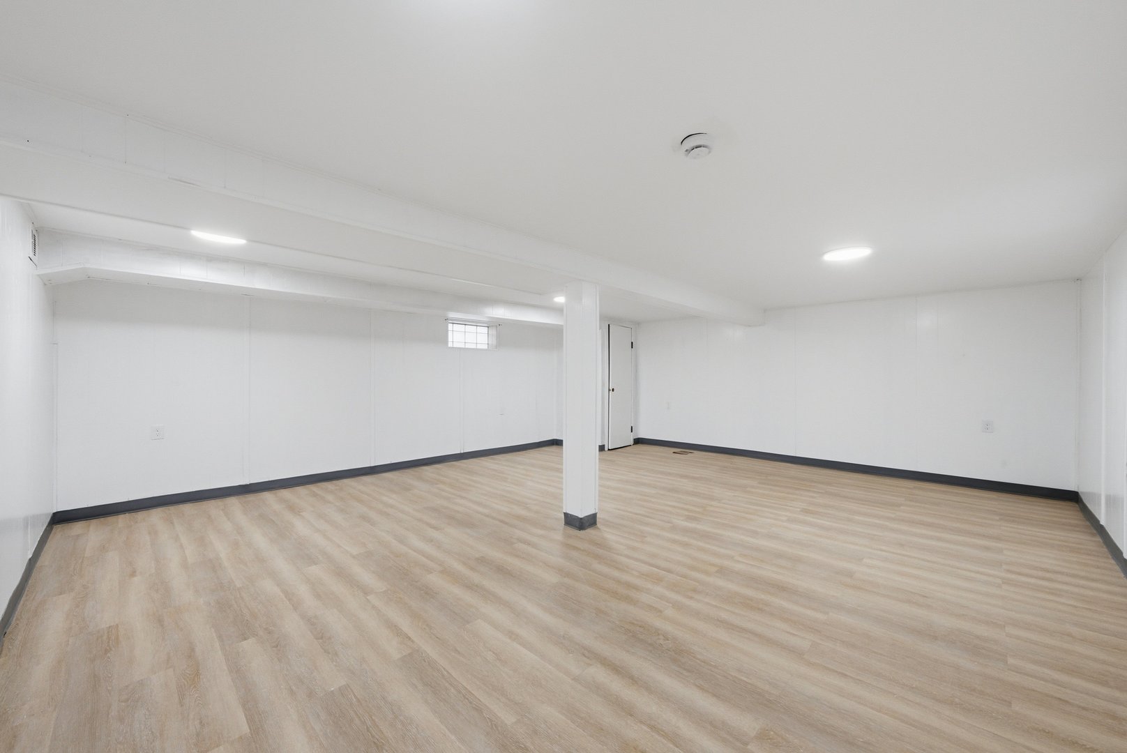 12358 South Lowe Avenue Chicago, IL 60628 - Photo 10 of 14 a view of an empty room and wooden floor