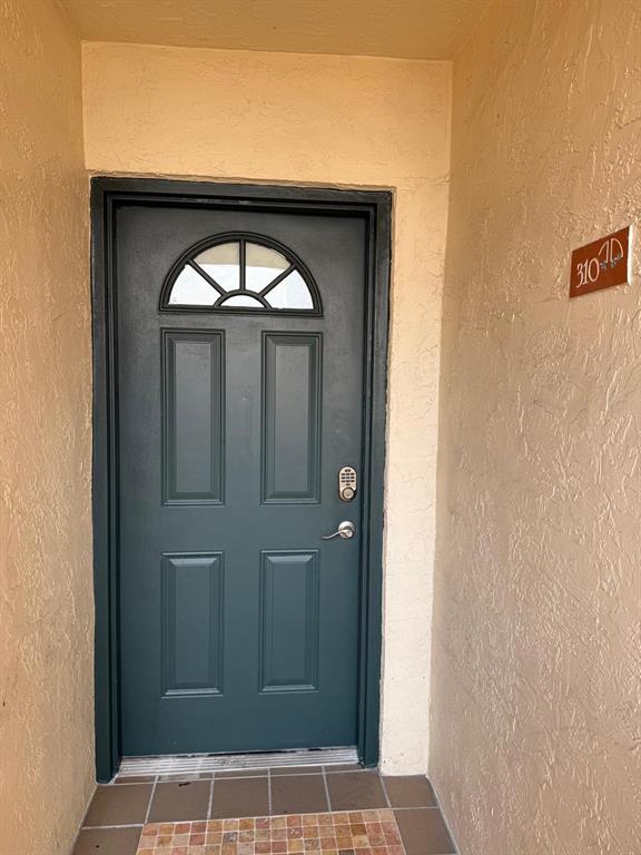 6276 Northwest 186th Street, Unit 310 Hialeah, FL 33015 - Photo 19 of 21 a view of front door