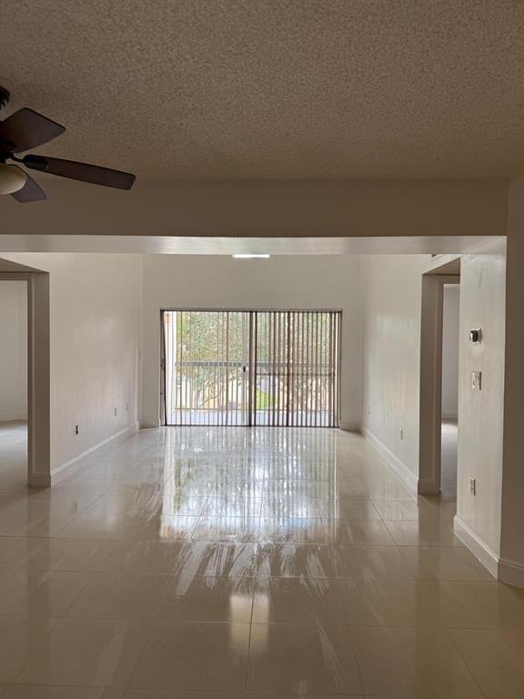 6276 Northwest 186th Street, Unit 310 Hialeah, FL 33015 - Photo 3 of 21 a view of an empty room with a window