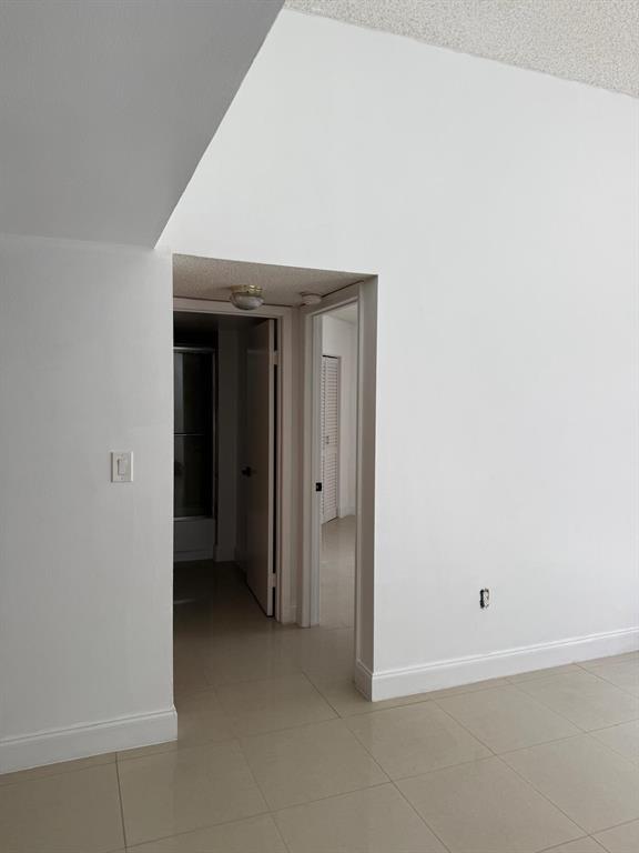 6276 Northwest 186th Street, Unit 310 Hialeah, FL 33015 - Photo 5 of 21 a view of an empty room