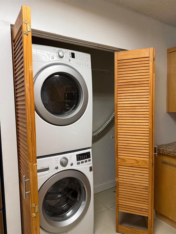 6276 Northwest 186th Street, Unit 310 Hialeah, FL 33015 - Photo 7 of 21 a utility room with dryer and washer
