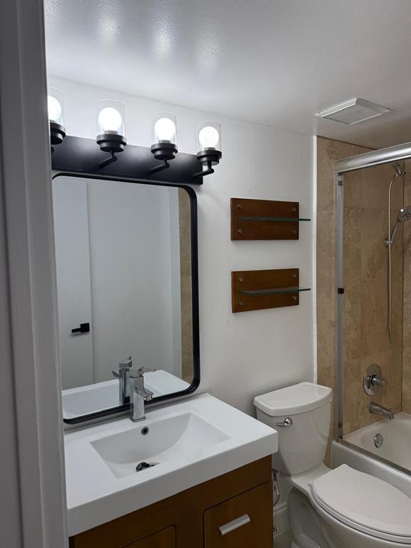 6276 Northwest 186th Street, Unit 310 Hialeah, FL 33015 - Photo 8 of 21 a bathroom with a sink a toilet and shower