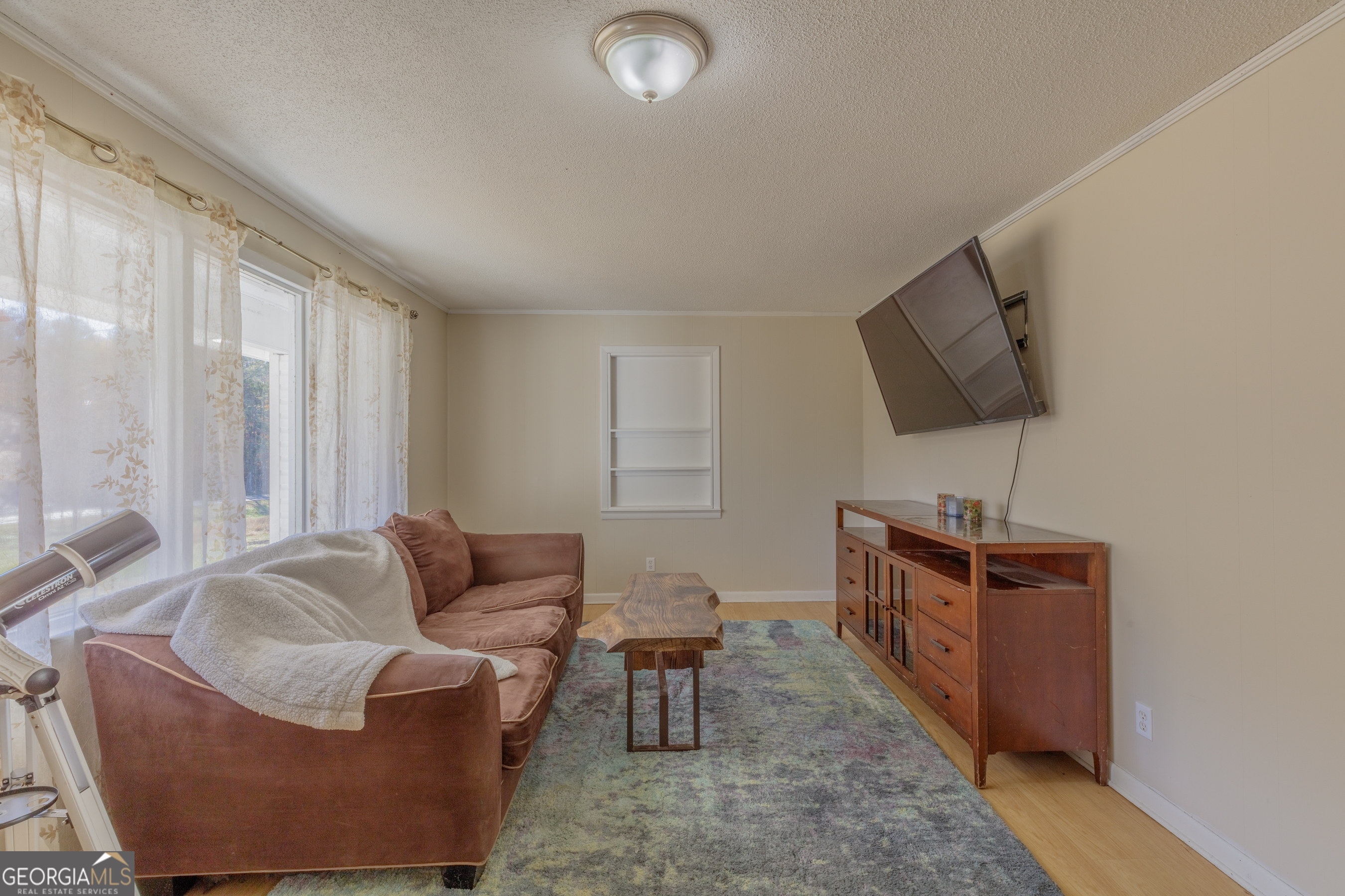 1144 Ridgeway Road LaFayette, GA 30728 - Photo 29 of 66 a living room with furniture and a flat screen tv