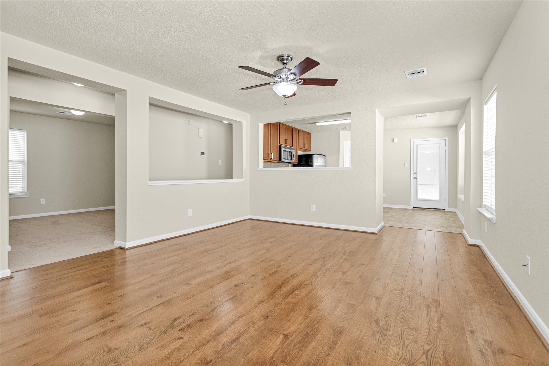 3131 Beacon Grove Street Spring, TX 77389 - Photo 7 of 38 a view of an empty room with wooden floor