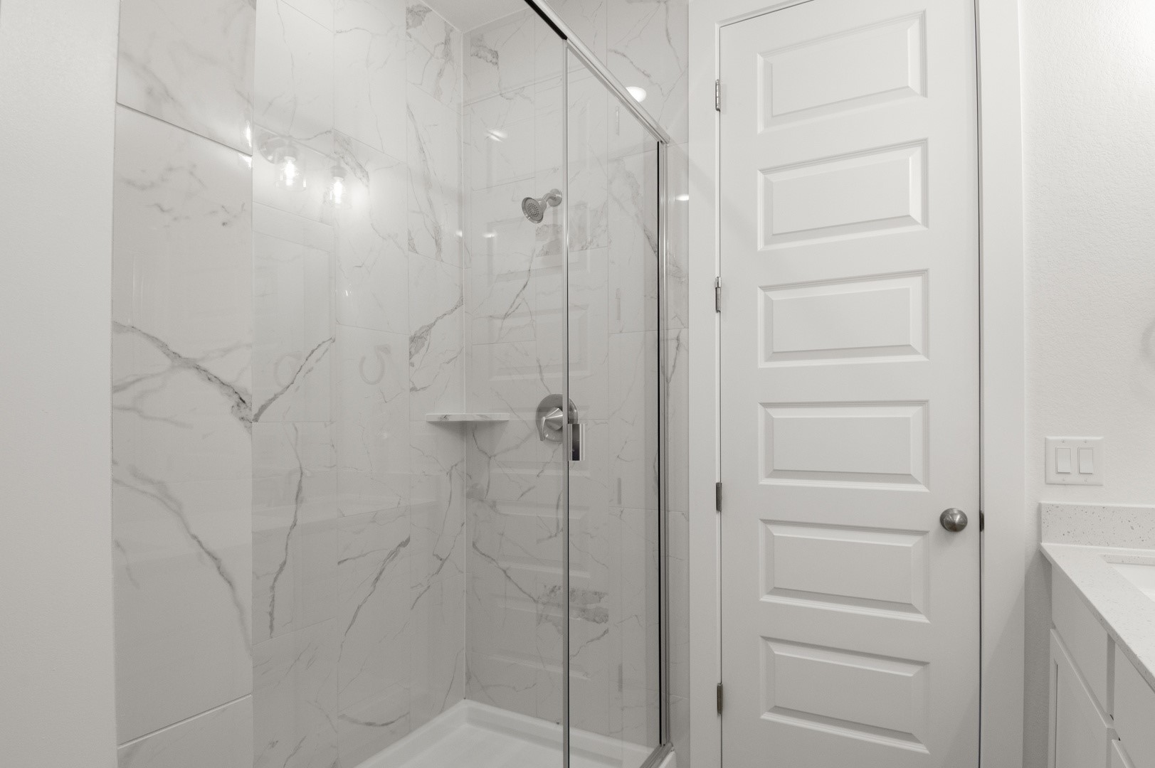 18909 Schultz Lane, Unit 1002 Round Rock, TX 78664 - Photo 21 of 24 Bathroom with vanity and a marble finish shower