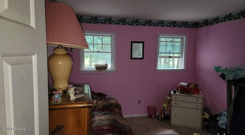 249 Pin Oak Road Stroudsburg, PA 18360 - Photo 30 of 34 a room with furniture and a window
