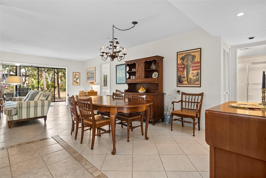 1703 Pelican Cove Road, Unit 356 Sarasota, FL 34231 - Photo 12 of 51 a view of a dining room with furniture